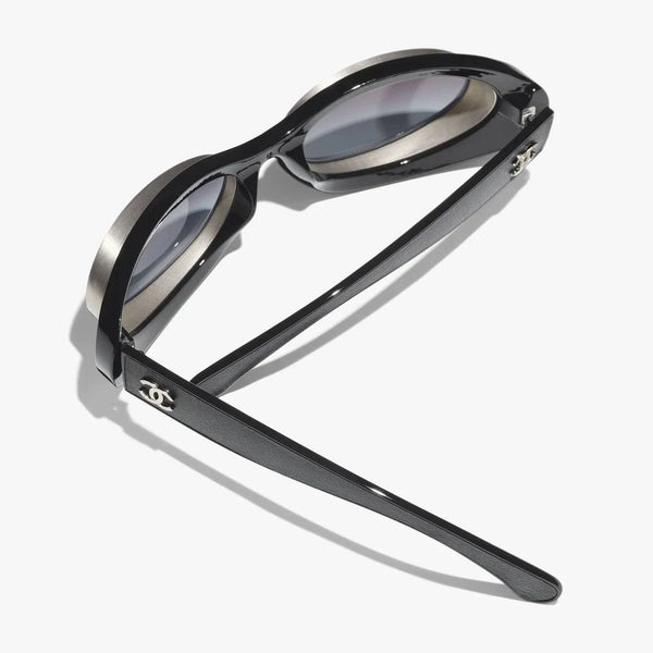 CHANEL sunglasses, black and silver, plastic and metal frame, UVA/UVB protection, adjustable nose pads.