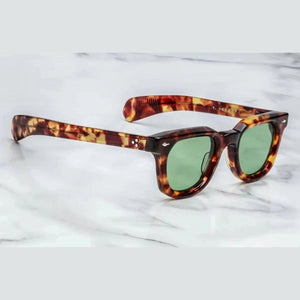 Jacques Marie Mage משקפיים מנומרות בהירות, מסגרת פלסטיק עם הגנת UVA/UVB ורפידות אף מתכווננות.