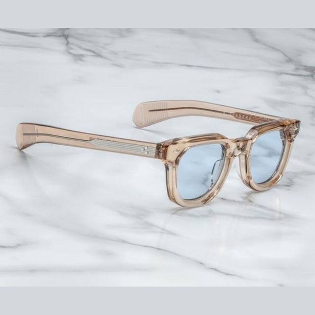 משקפי שמש Jacques Marie Mage מסגרת ניוד שקוף עם הגנה UVA/UVB, רפידות אף מתכווננות ועדשות ראיה.